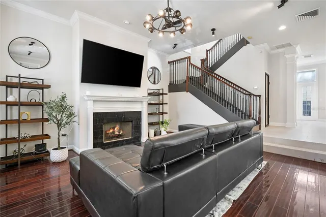 a living room with furniture fireplace and flat screen tv