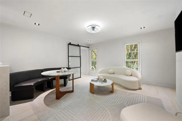 a living room with furniture and a window