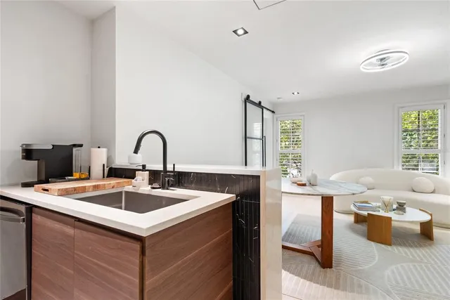 a living room with furniture and window