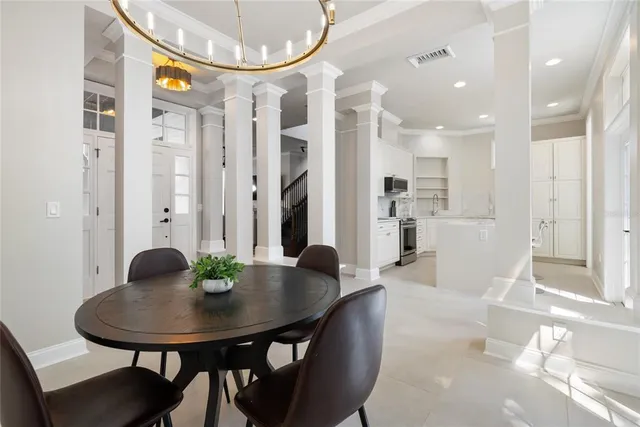 a front view of a house with a table and chairs