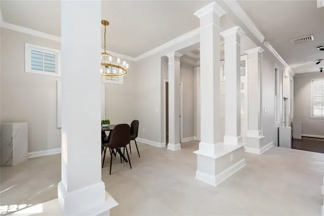 a view of a hallway with seating area