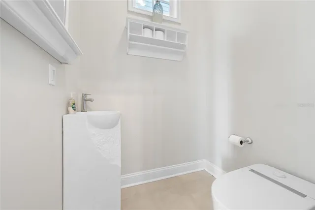 a bathroom with a sink and toilet