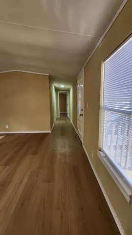 a view of an empty room and window