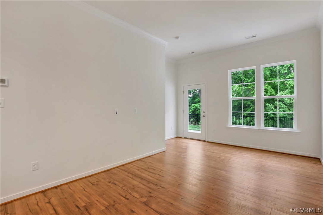 4208 Lind Lane Midlothian, VA 23112 - Photo 9 of 34 a view of an empty room with wooden floor and a window