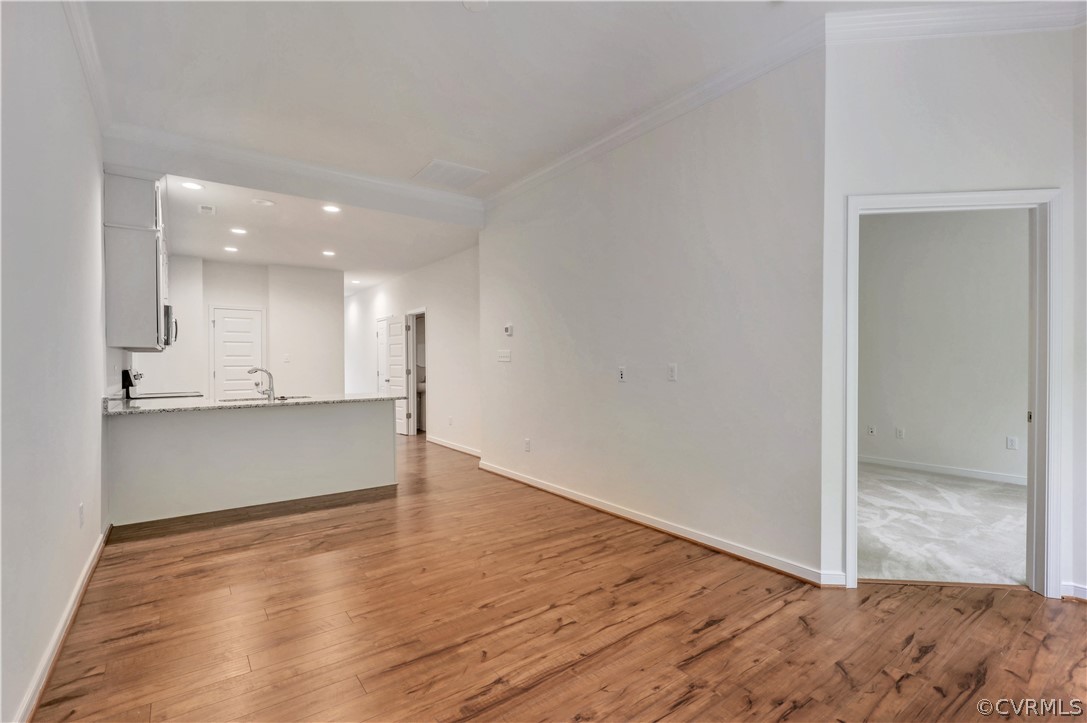 4208 Lind Lane Midlothian, VA 23112 - Photo 10 of 34 a view of an empty room and kitchen with wooden floor