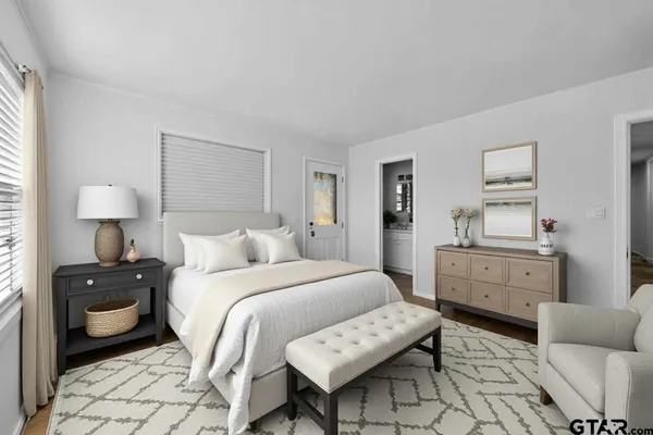 a bedroom with a bed and a dresser