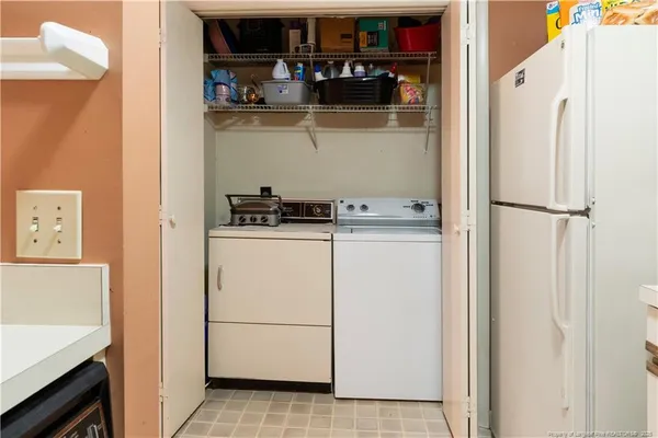 a kitchen with a refrigerator and cabinets