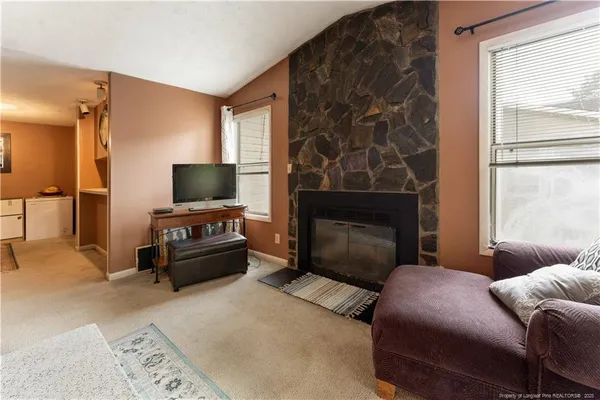 a bedroom with a bed and a television