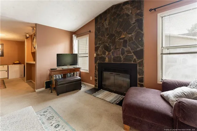 a bedroom with a bed and a television