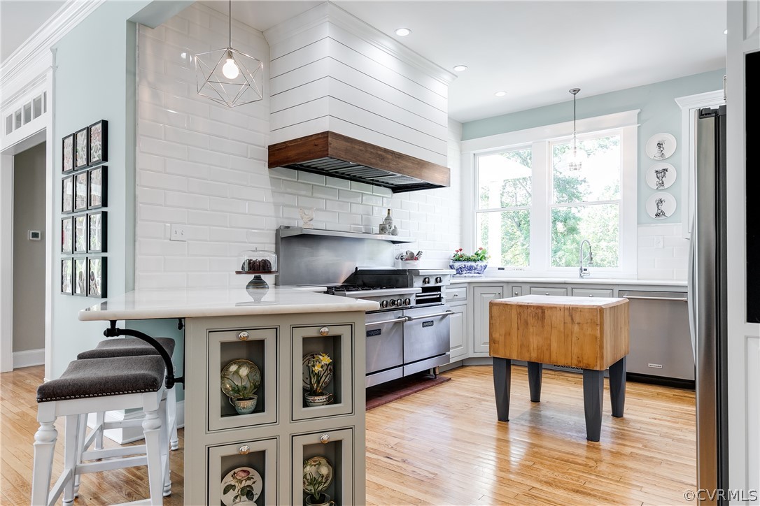 1720 Norwood Road Bruington, VA 23023 - Photo 12 of 50 a kitchen with a stove and a wooden floor