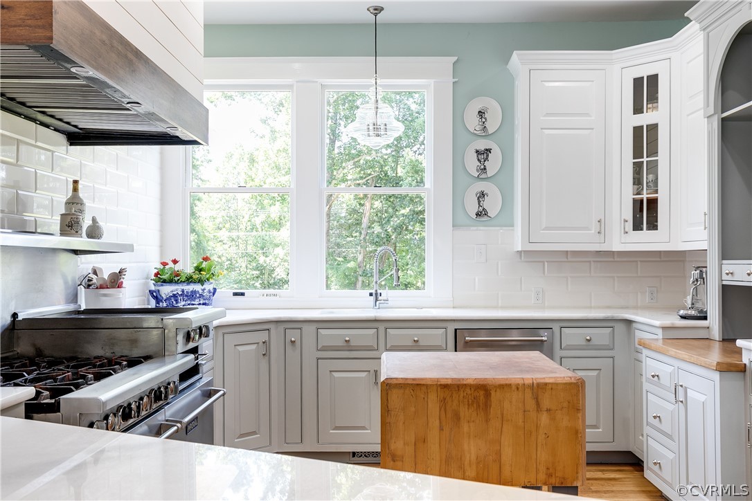 1720 Norwood Road Bruington, VA 23023 - Photo 13 of 50 a kitchen with stainless steel appliances a stove a sink a window and cabinets