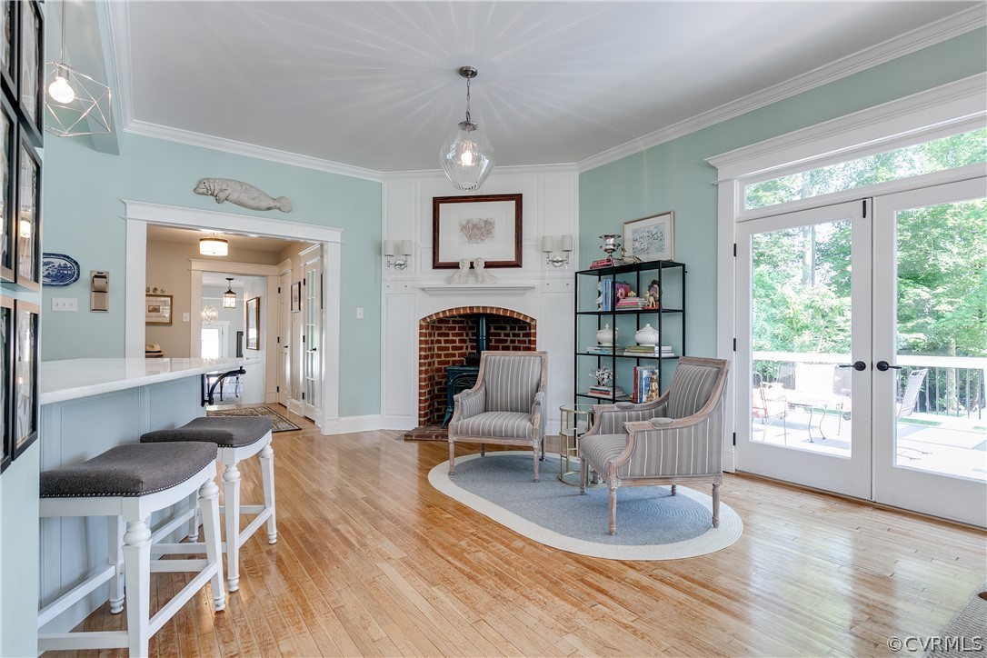 1720 Norwood Road Bruington, VA 23023 - Photo 16 of 50 a dining room with furniture a flat screen tv and a large window