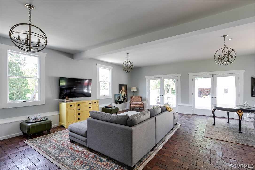 1720 Norwood Road Bruington, VA 23023 - Photo 20 of 50 a living room with furniture a flat screen tv and a window
