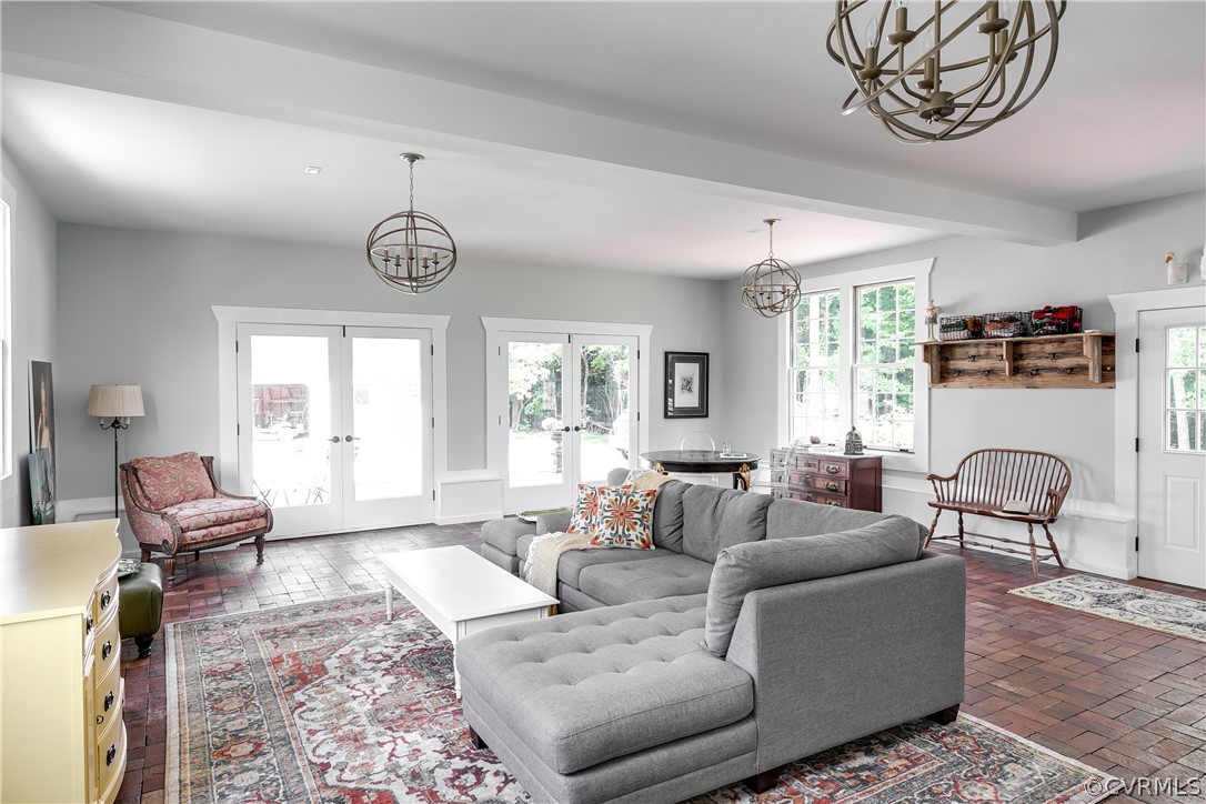 1720 Norwood Road Bruington, VA 23023 - Photo 21 of 50 a living room with furniture a window and a chandelier