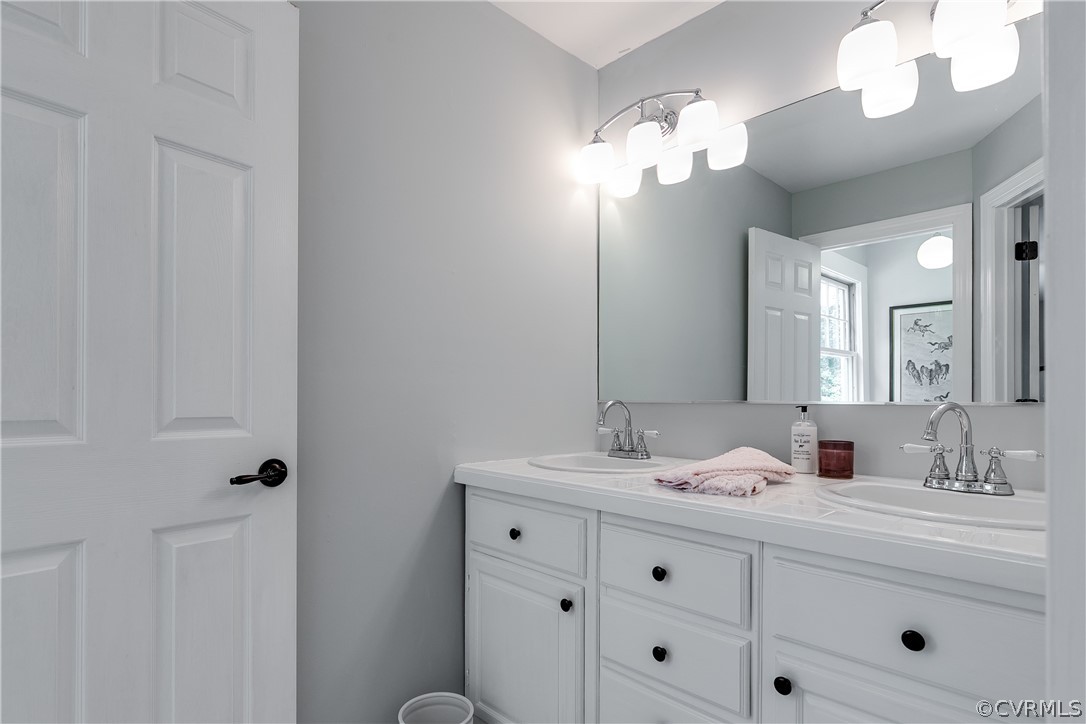 1720 Norwood Road Bruington, VA 23023 - Photo 25 of 50 a bathroom with a sink vanity and a mirror