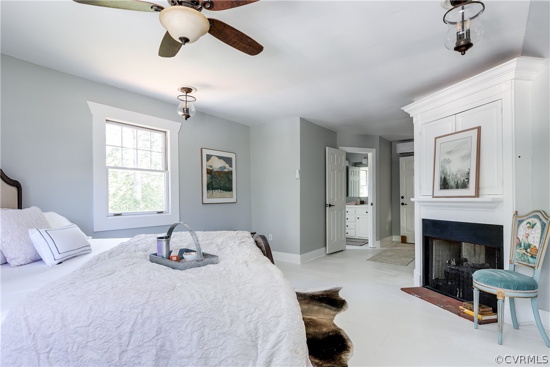 1720 Norwood Road Bruington, VA 23023 - Photo 28 of 50 a bedroom with a bed and a fireplace