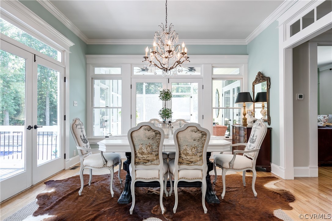 1720 Norwood Road Bruington, VA 23023 - Photo 10 of 50 a view of a dining room with furniture a chandelier and wooden floor