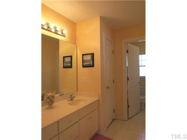 10805 Sagehurst Place Raleigh, NC 27614 - Photo 20 of 25 View of the lg divided hall Bath w/dbl sinks, tile flr & tiled tub/shower surround. Bathroom