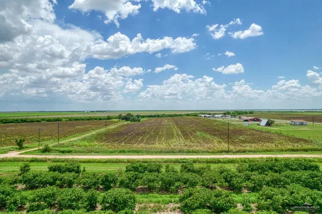 a view of an ocean and a yard