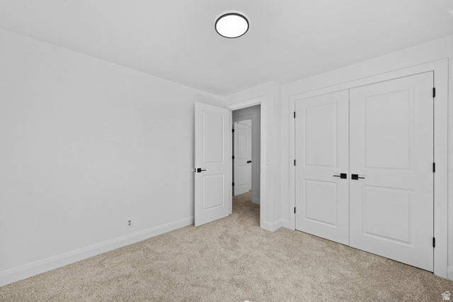 2267 West 4350th Street South Roy, UT 84067 - Photo 21 of 32 Unfurnished bedroom featuring light colored carpet and a closet