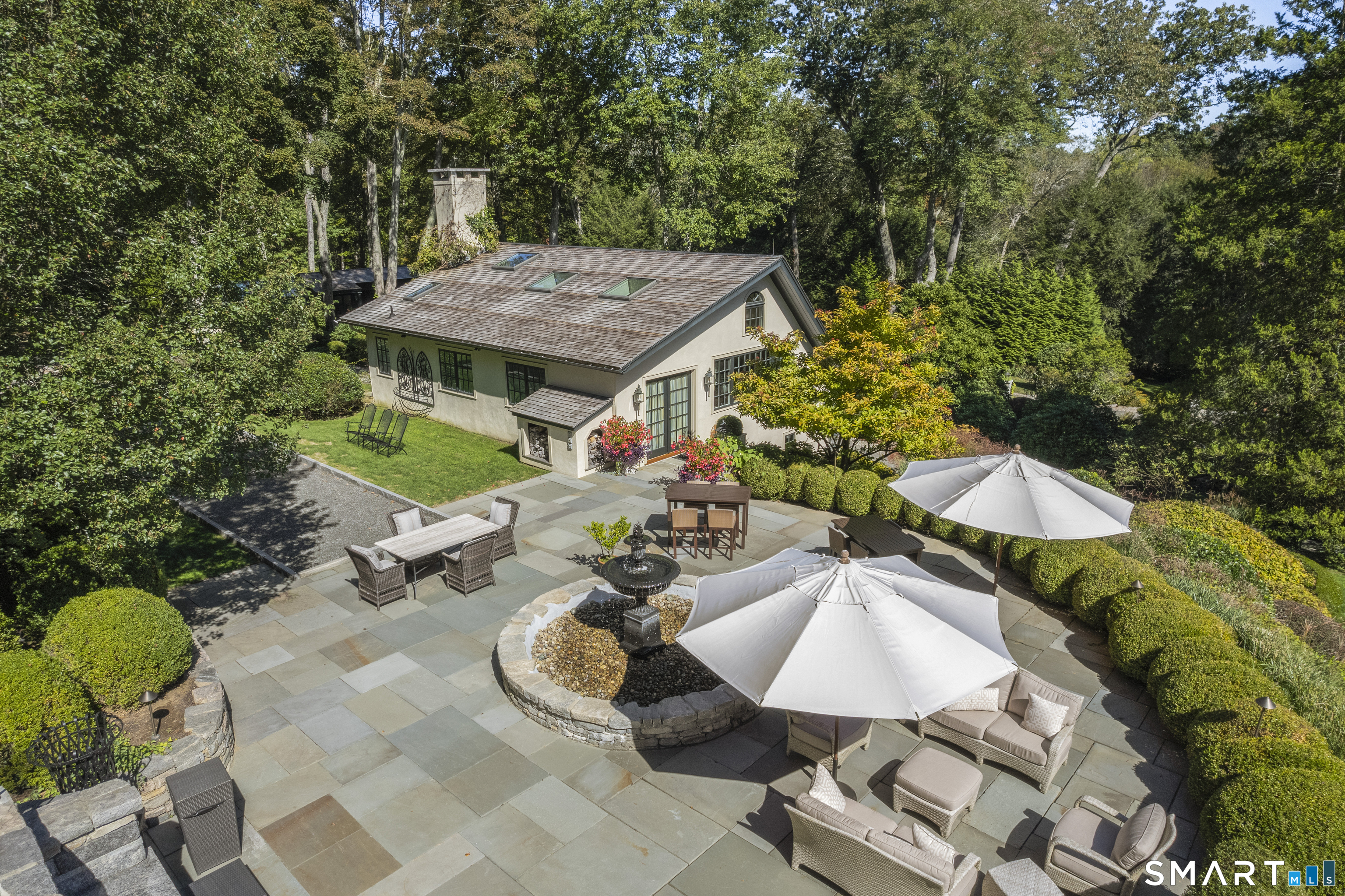 252 River Road Deep River, CT 06417 - Photo 31 of 40 Upper Pool House access to sprawling flagstone terrace overlooking pool w/outdoor kitchen, multiple seating areas, fire bowl features, & flowing fountain.