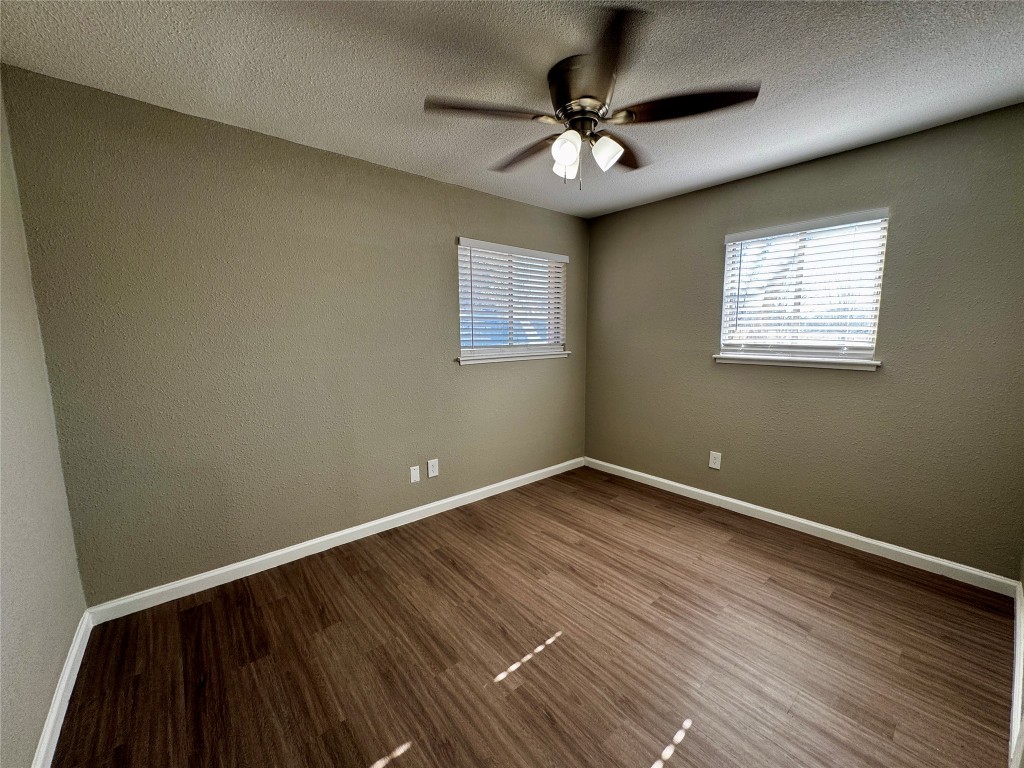 202 West N Loop Boulevard, Unit A Austin, TX 78751 - Photo 4 of 6 a view of an empty room with wooden floor and a window