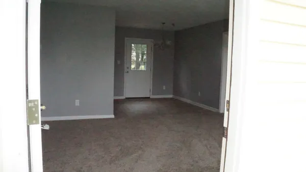 a view of a room with a hallway