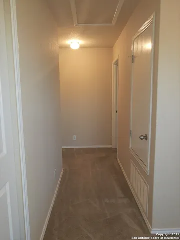 a view of hallway with shower