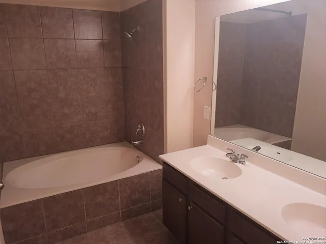 a bathroom with a sink and a bathtub