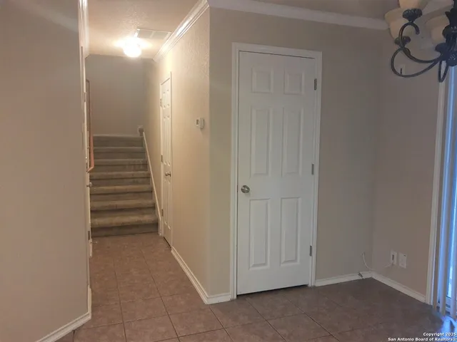 a view of a hallway with closet and entryway