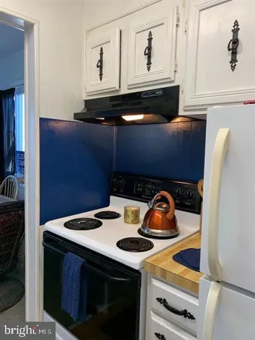 a kitchen with a stove and a microwave