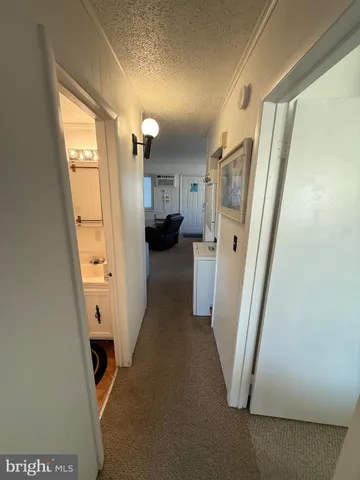 a view of a hallway with windows