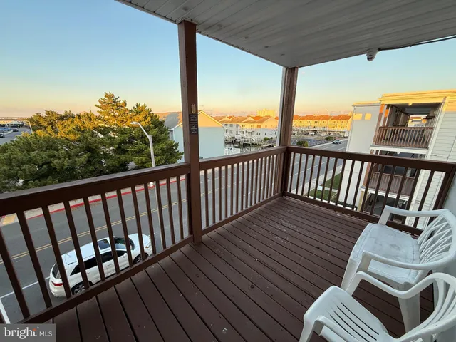 a view of balcony with wooden floor