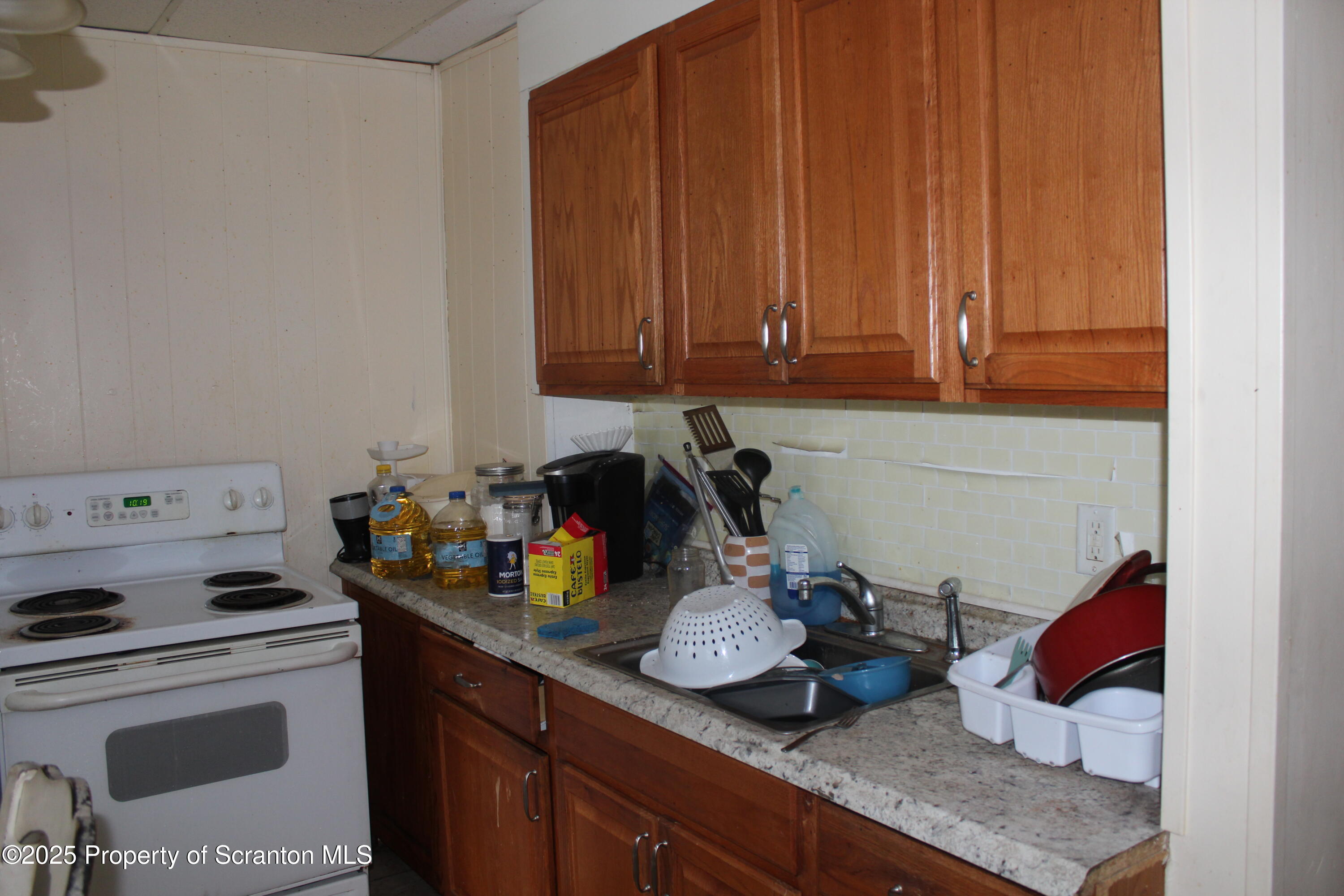 333 Spring Street Scranton, PA 18508 - Photo 15 of 43 a kitchen with a sink a stove and cabinets