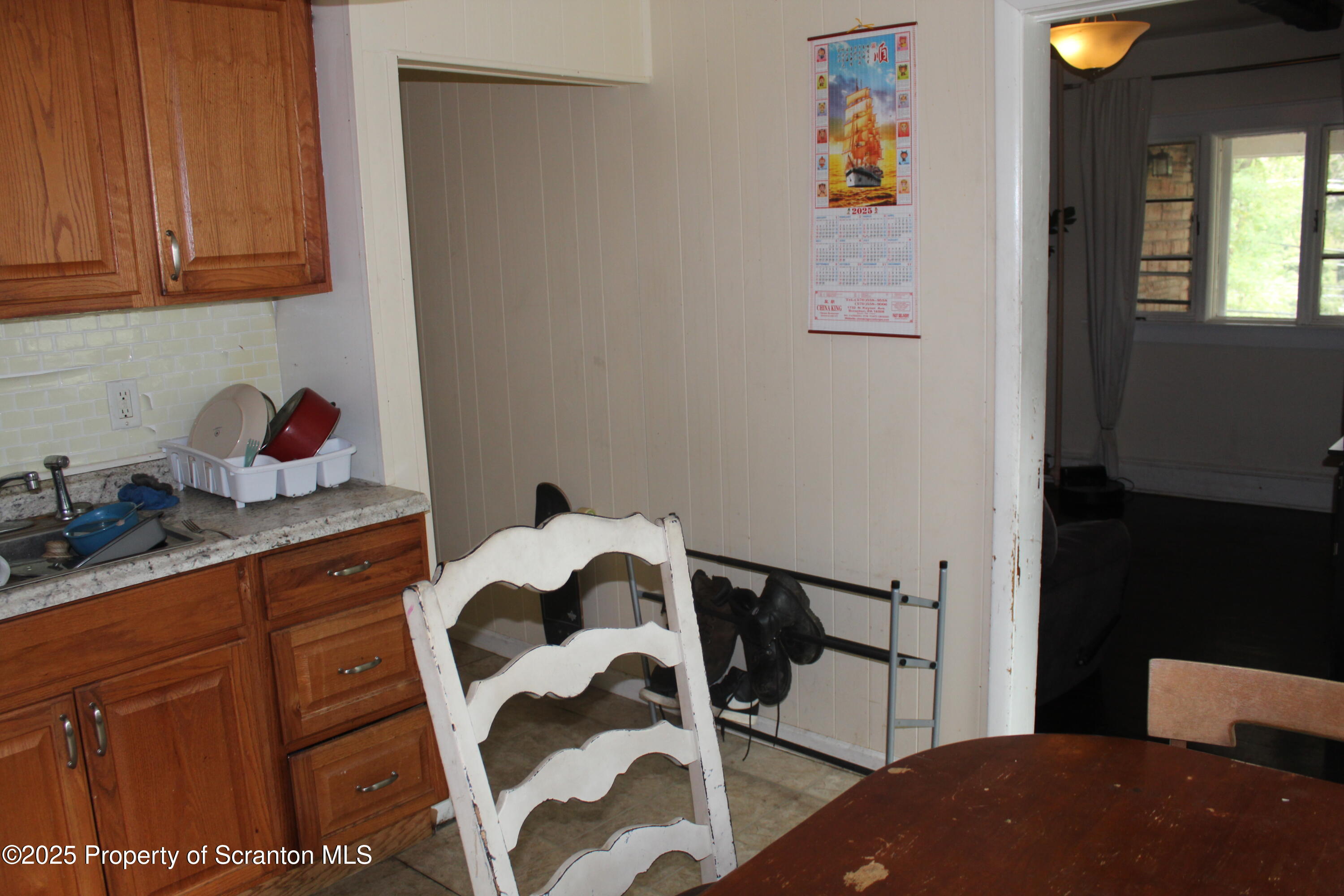 333 Spring Street Scranton, PA 18508 - Photo 16 of 43 a kitchen with a cabinets a sink and a stove next to a window