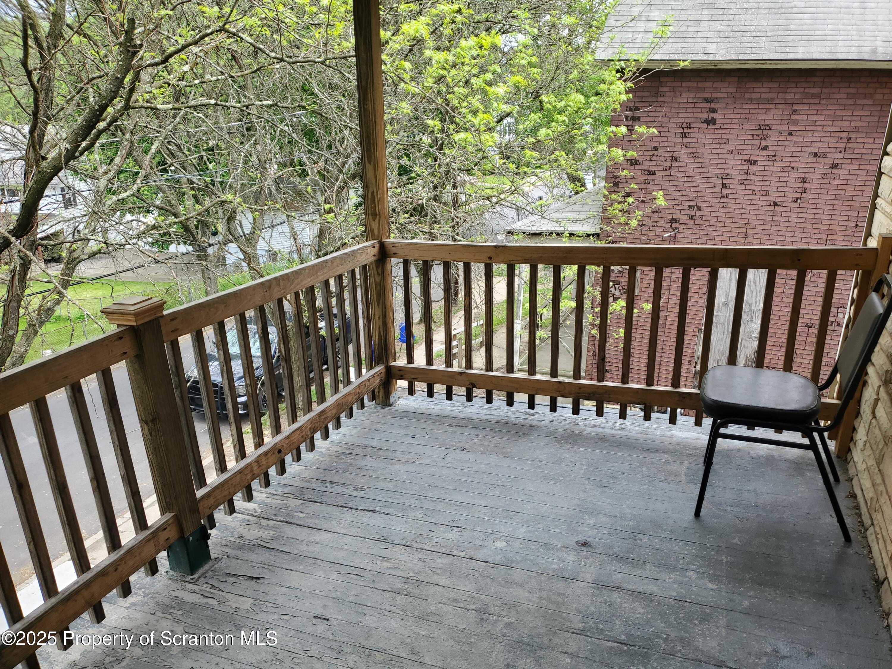 333 Spring Street Scranton, PA 18508 - Photo 7 of 43 a view of a wooden bench in the balcony