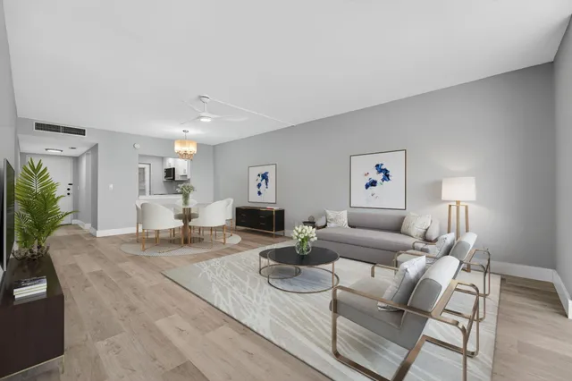 a living room with furniture and a table