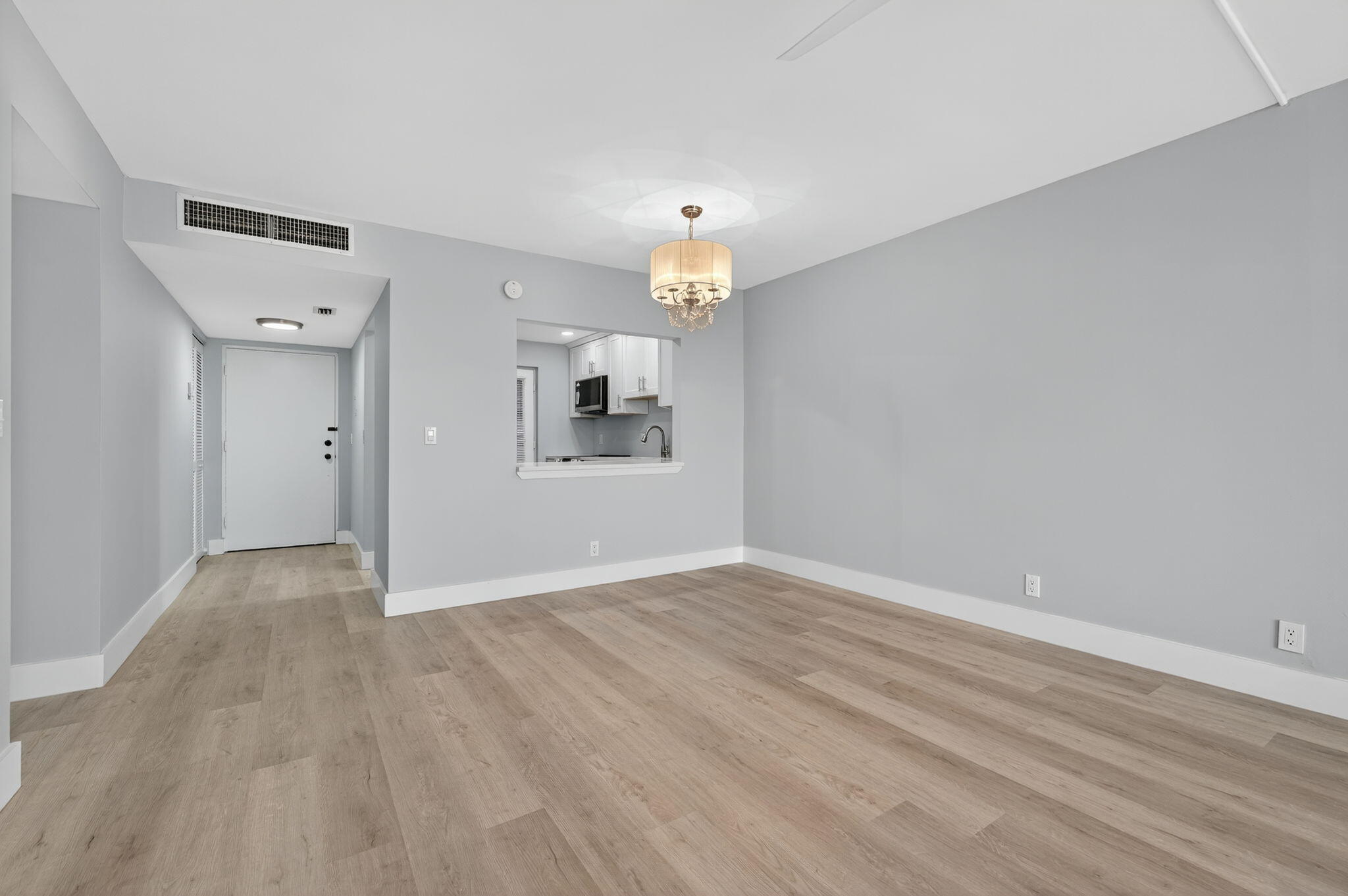 5500 Northwest 2nd Avenue, Unit 314 Boca Raton, FL 33487 - Photo 11 of 35 wooden floor in an empty room with a window