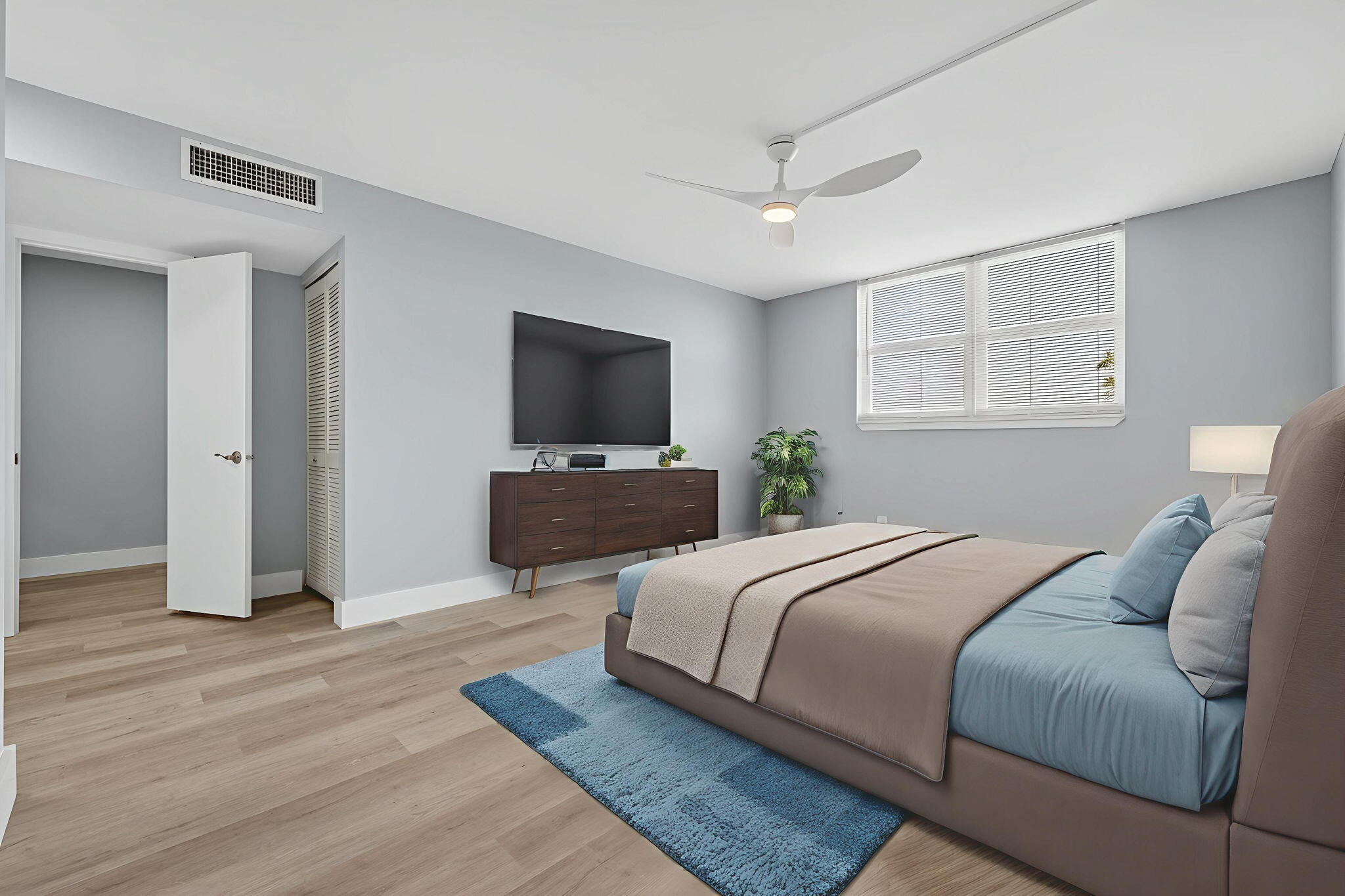 5500 Northwest 2nd Avenue, Unit 314 Boca Raton, FL 33487 - Photo 12 of 35 a bedroom with a bed and a flat screen tv