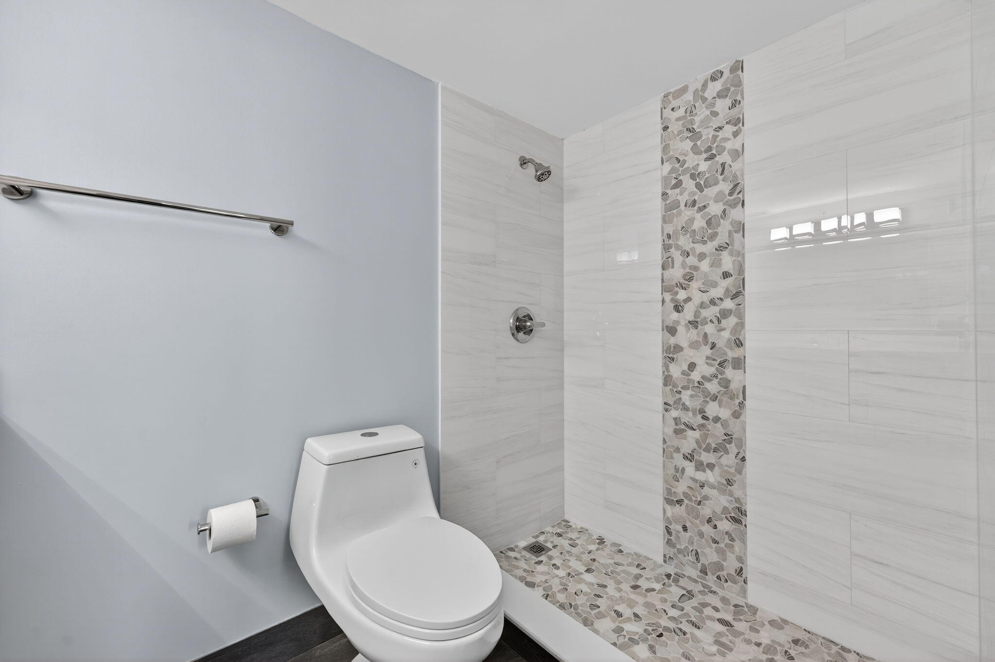 5500 Northwest 2nd Avenue, Unit 314 Boca Raton, FL 33487 - Photo 17 of 35 a white toilet sitting next to a shower