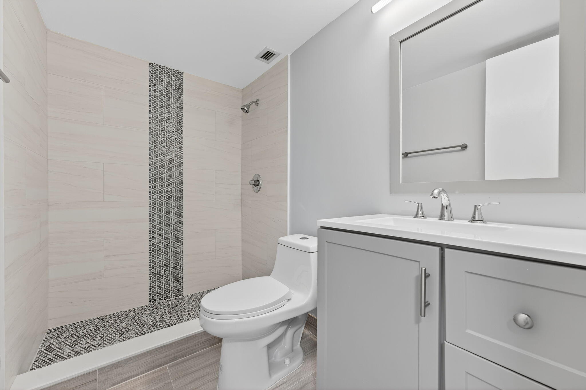 5500 Northwest 2nd Avenue, Unit 314 Boca Raton, FL 33487 - Photo 20 of 35 a bathroom with a sink a toilet and shower