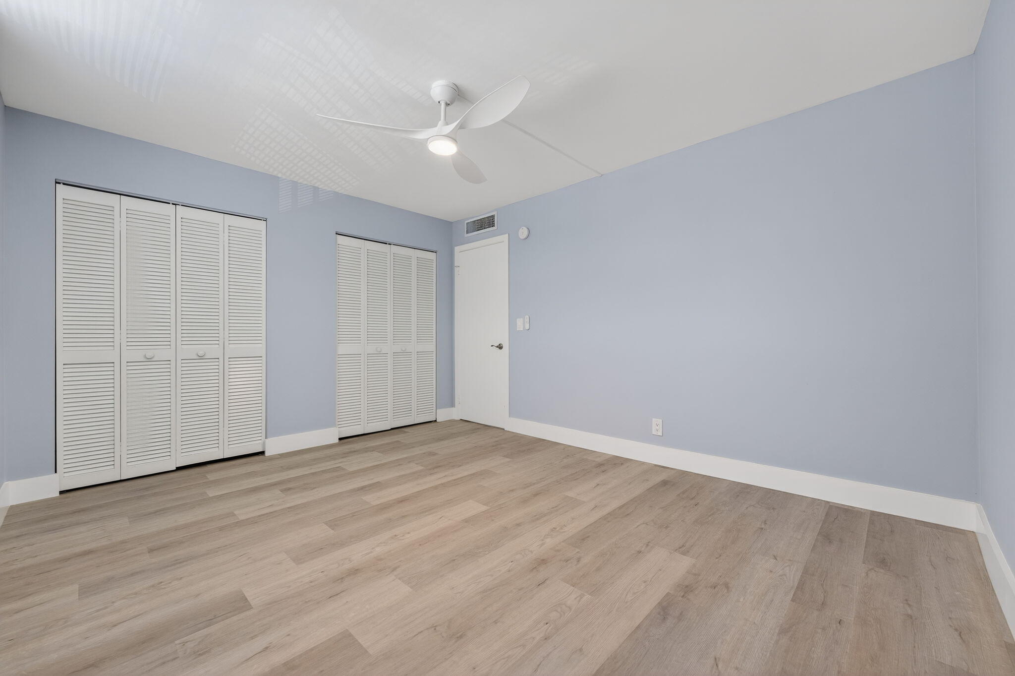 5500 Northwest 2nd Avenue, Unit 314 Boca Raton, FL 33487 - Photo 22 of 35 a view of an empty room with wooden floor