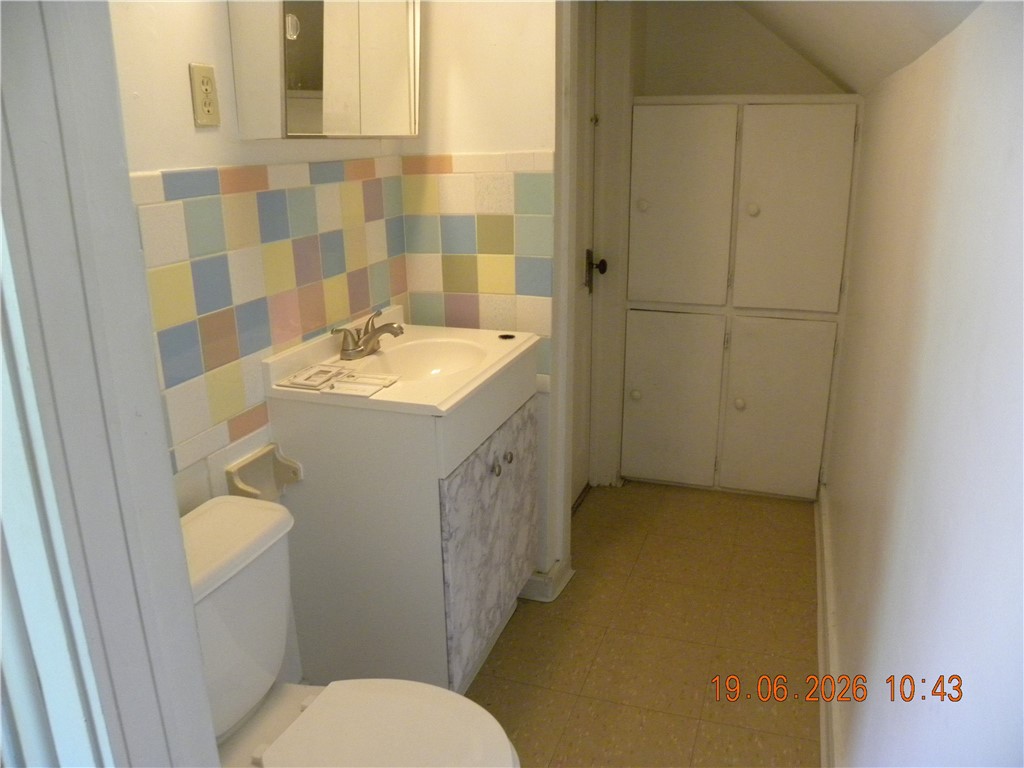 16 South Maple Street Corning, NY 14830 - Photo 10 of 12 Jack and Jill half bath