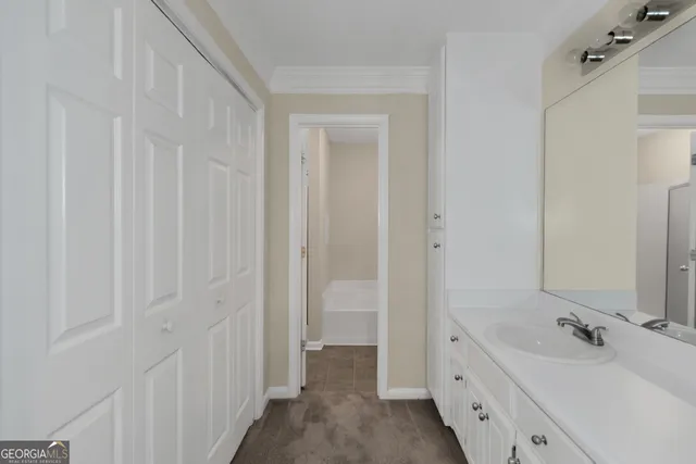a bathroom with a double vanity sink and mirror