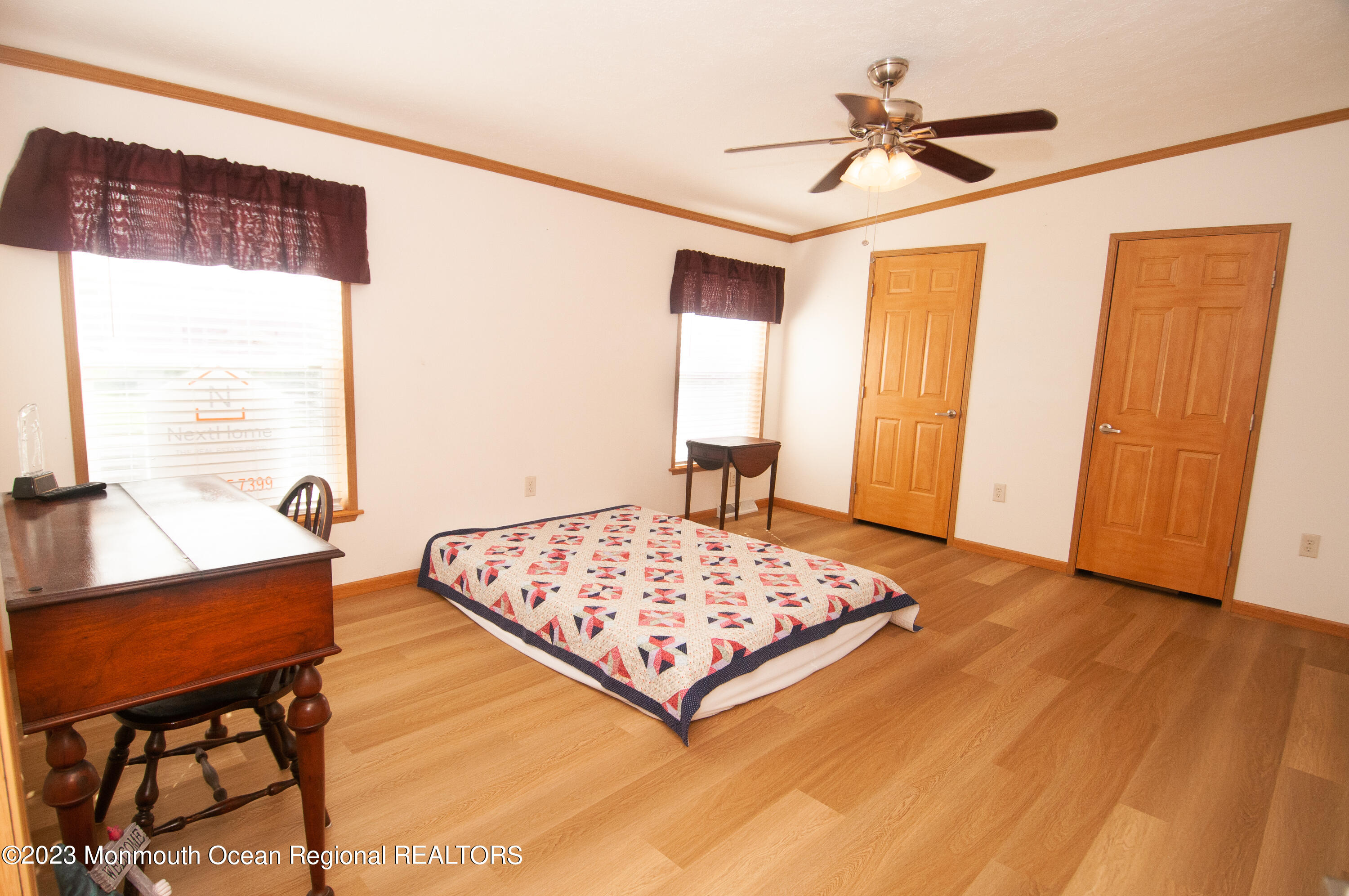 116 Woody Road Freehold, NJ 07728 - Photo 25 of 33 a living room with a bed and a table