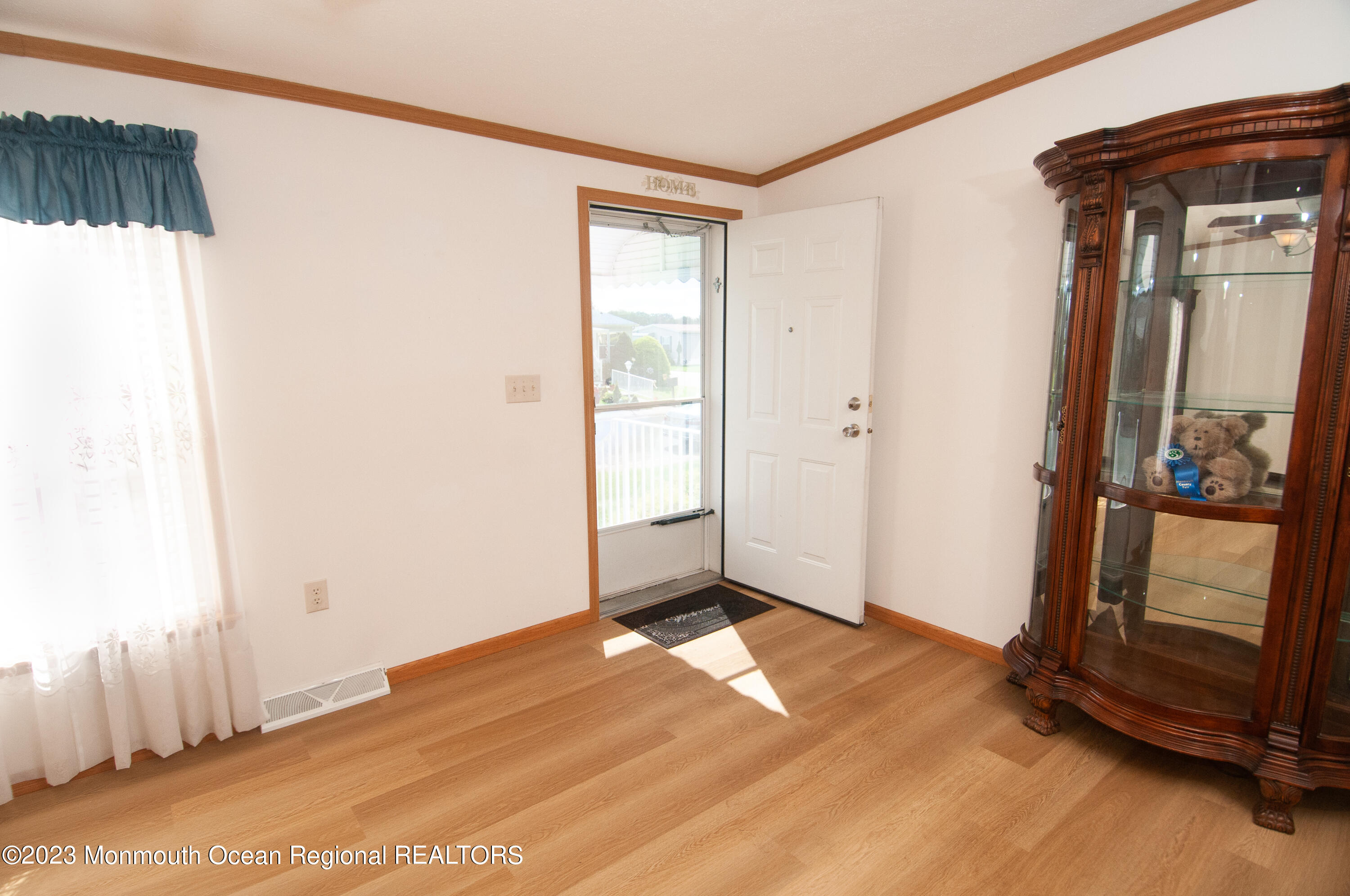 116 Woody Road Freehold, NJ 07728 - Photo 5 of 33 a view of a room with wooden floor and windows