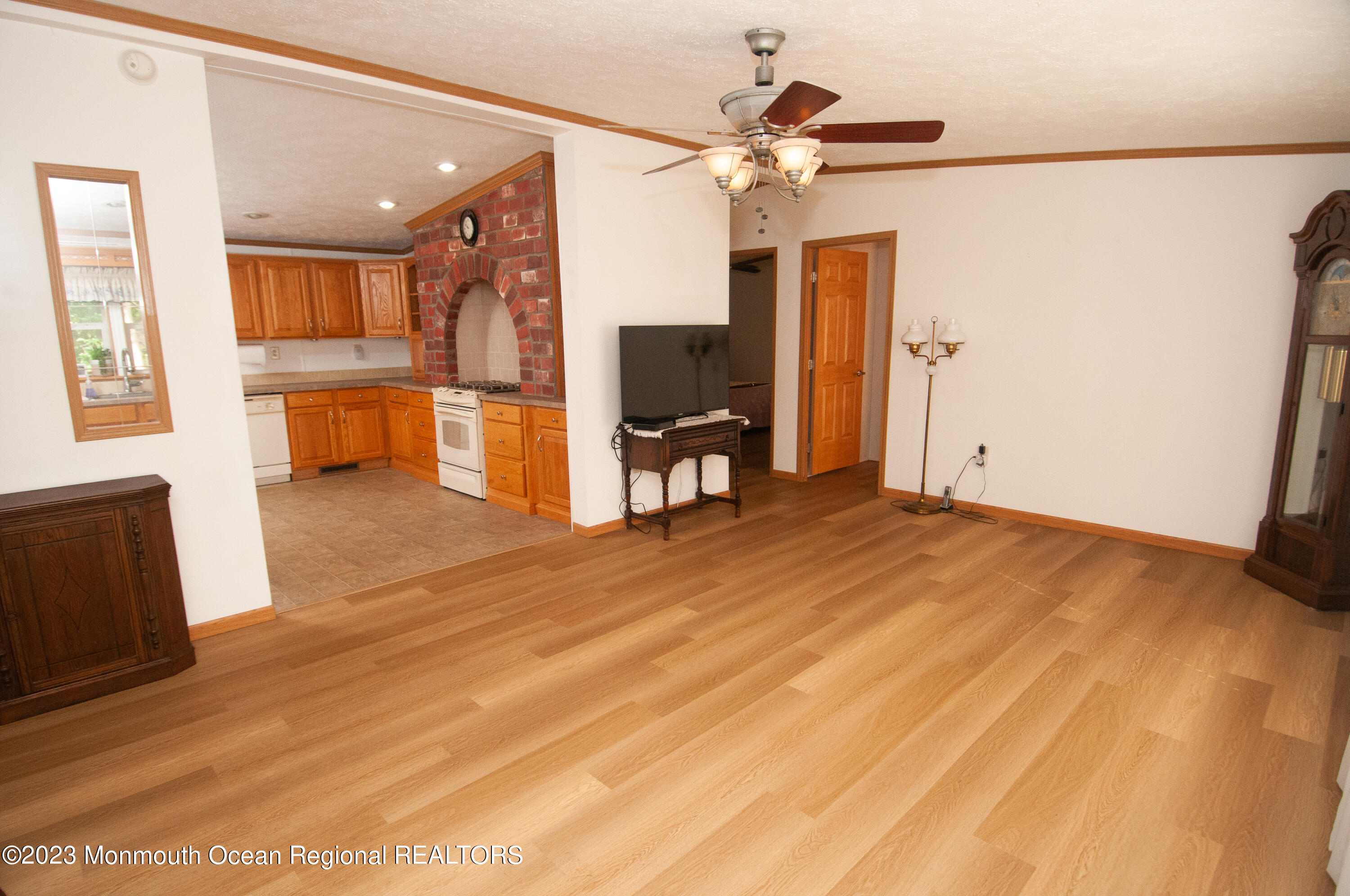 116 Woody Road Freehold, NJ 07728 - Photo 6 of 33 a view of a livingroom with furniture and a kitchen