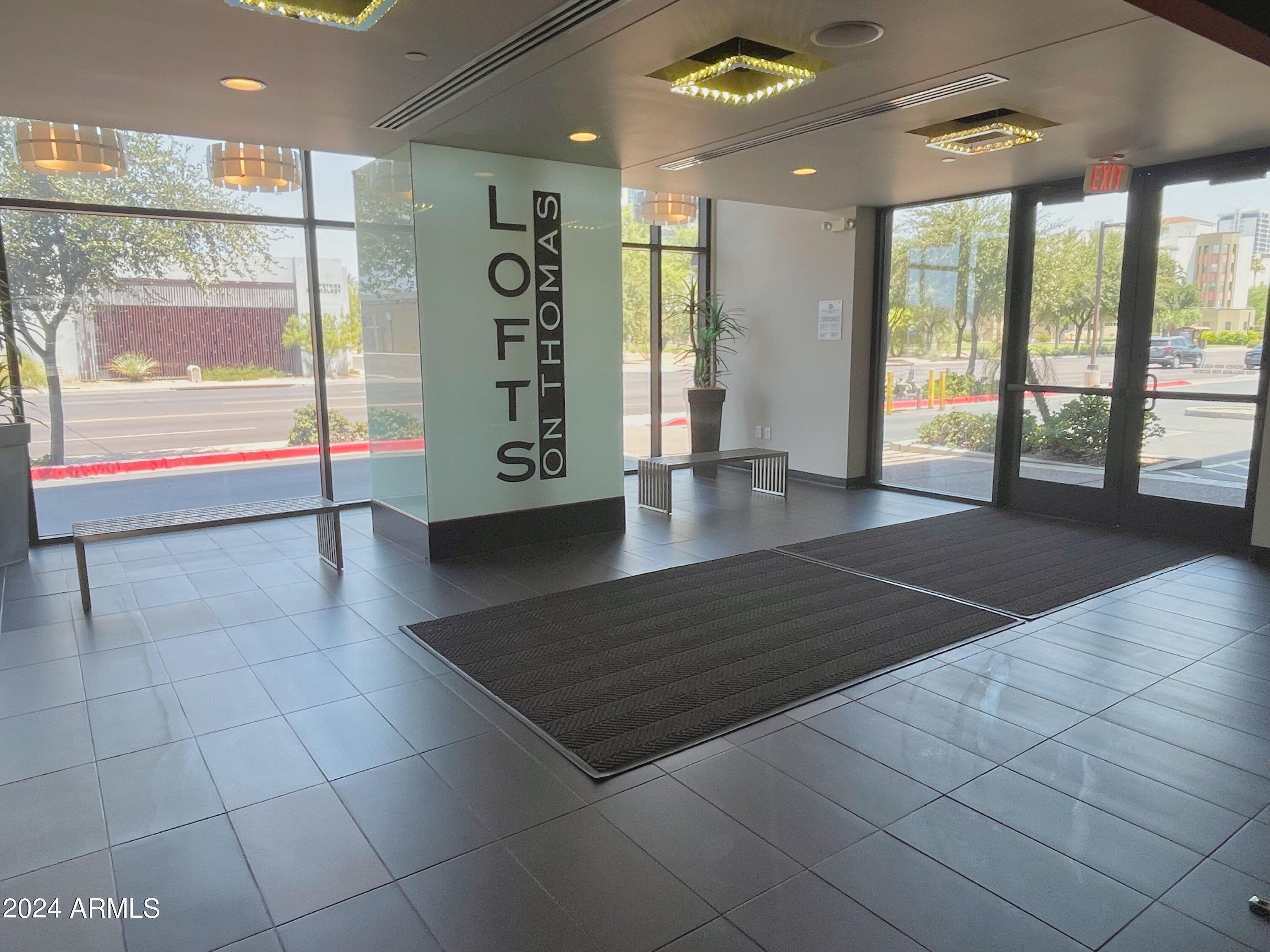 535 West Thomas Road, Unit 401 Phoenix, AZ 85013 - Photo 13 of 22 a view of an empty room with glass door