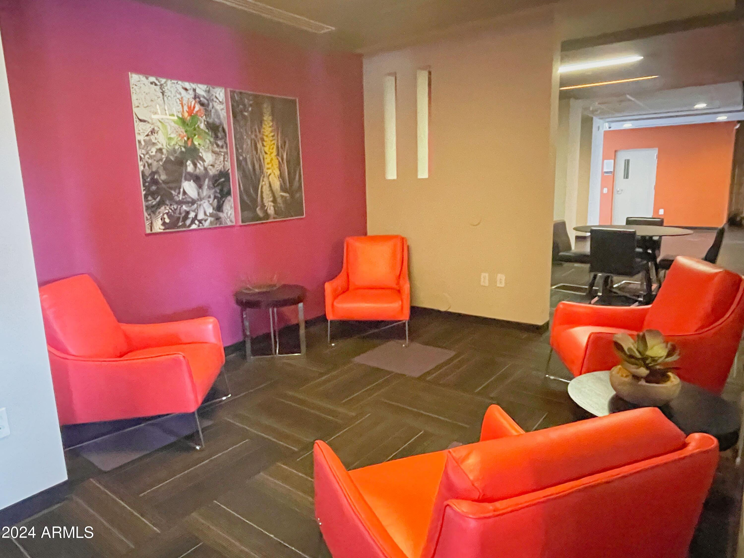 535 West Thomas Road, Unit 401 Phoenix, AZ 85013 - Photo 14 of 22 a room with furniture and a lamp