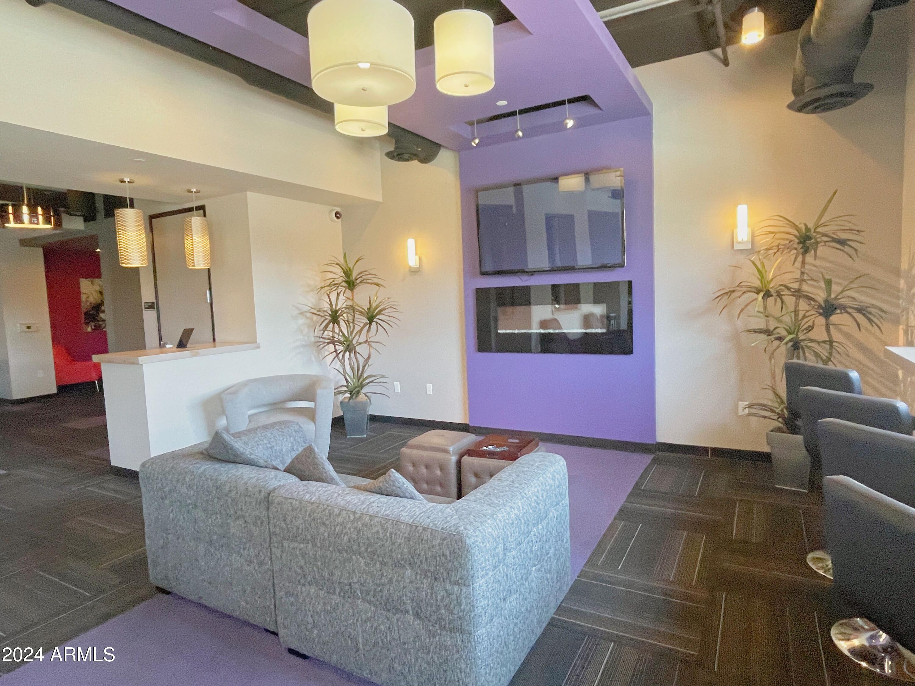 535 West Thomas Road, Unit 401 Phoenix, AZ 85013 - Photo 18 of 22 a living room with furniture and wooden floor